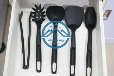 a group of utensils sitting in a drawer at Binjai 8 Premium Soho by Heaven Stay in Kuala Lumpur