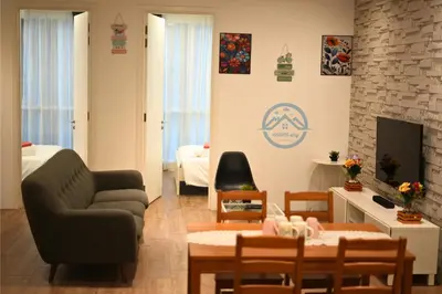 a living room with a couch and a table at Binjai 8 Premium Soho by Heaven Stay in Kuala Lumpur