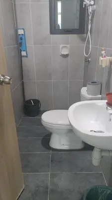 a bathroom with a toilet and a sink at Legasi Kampong Bharu in Kuala Lumpur