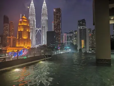 a view of a city skyline at night at Legasi Kampong Bharu in Kuala Lumpur