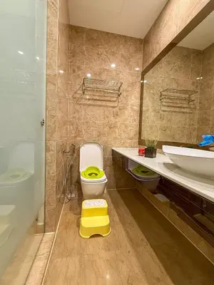 a bathroom with a toilet and a sink and a tub at TRX Pavilion Top Floor Suite, Kid-Friendly Slide, Dorsett Bukit Bintang KL, Kuala Lumpur Malaysia in Kuala Lumpur