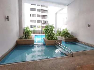 an indoor pool in a building with potted plants at Seri Bukit Ceylon By Katy in Kuala Lumpur