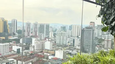 a view of a city with tall buildings at Majestic Residences KLCC By Cozy in Kuala Lumpur