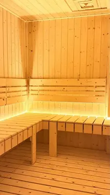 a empty sauna with wooden benches in a room at Majestic Residences KLCC By Cozy in Kuala Lumpur