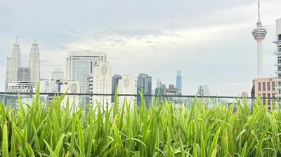 a view of a city skyline with tall buildings at Majestic Residences KLCC By Cozy in Kuala Lumpur