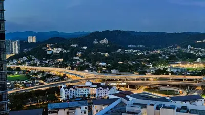 an overhead view of a city with buildings and a freeway at The Elements Ampang A place of Tranquility Premium in Kuala Lumpur