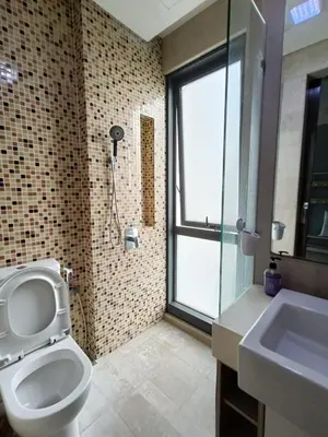 a bathroom with a toilet and a sink and a window at The Elements Ampang A place of Tranquility Premium in Kuala Lumpur