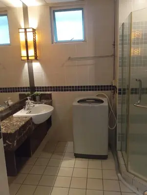 a bathroom with a toilet and a sink and a shower at Sky suite at Seri Bukit Ceylon in Kuala Lumpur