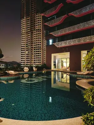 a swimming pool in front of a building at Arte Plus by Stay Relax in Kuala Lumpur