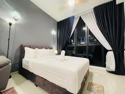 a bedroom with a large bed and a window at Kuala Lumpur Luxury Suites By Majestic Residence in Kuala Lumpur