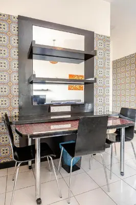 a dining room with a table and chairs at Seri Bukit Ceylon apartment in Kuala Lumpur