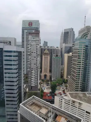 a view of a city skyline with tall buildings at Seri Bukit Ceylon apartment in Kuala Lumpur