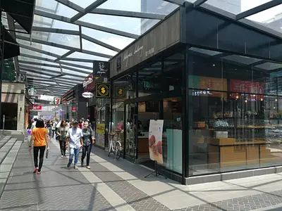 a group of people walking in front of a building at Fahrenheit88Newly renovated 2mins Pavilion KL KLCC view in Kuala Lumpur