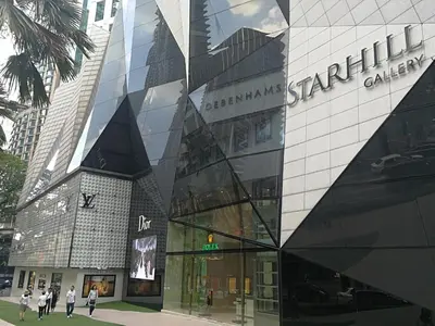 a building with people walking in front of it at Fahrenheit88Newly renovated 2mins Pavilion KL KLCC view in Kuala Lumpur