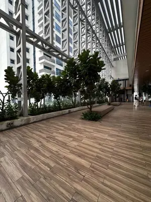 a hallway in a building with trees and buildings at The Colony By Infinitum With Klcc View in Kuala Lumpur