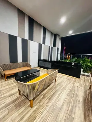 a room with couches and tables in a building at The Colony By Infinitum With Klcc View in Kuala Lumpur