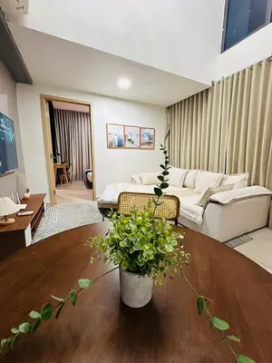 a living room with a couch and a table at The Colony By Infinitum With Klcc View in Kuala Lumpur