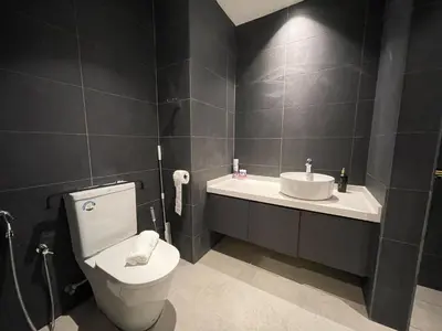 a bathroom with a toilet and a sink at Novo Suites Kuala Lumpur by Nestaway Jalan Ampang in Kuala Lumpur