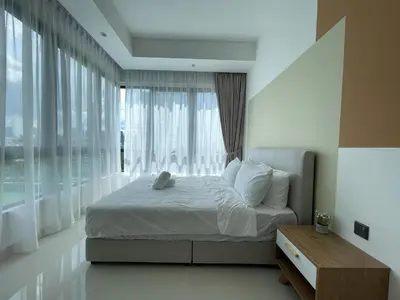 a bedroom with a bed and a large window at Novo Suites Kuala Lumpur by Nestaway Jalan Ampang in Kuala Lumpur