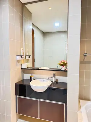 a bathroom with a sink and a mirror at KLCC Marc Residence by AZ Line in Kuala Lumpur