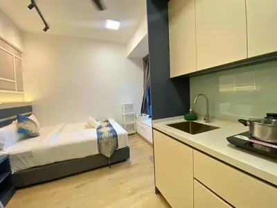 a kitchen with a bed and a sink in a room at The Colony By Infinitum KLCC - Aura Suites in Kuala Lumpur