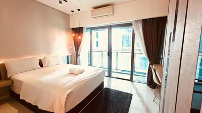 a hotel room with a bed and a large window at Studio Apartment KLCC Area in Kuala Lumpur