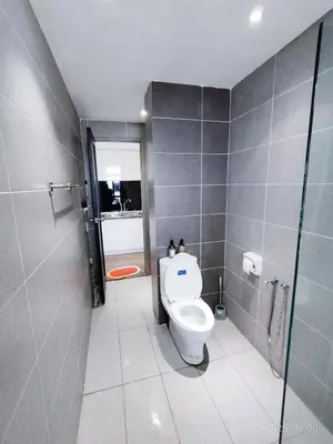 a bathroom with a toilet and a shower stall at Arina Uniti Kampung Baru HKL - Idealhub in Kuala Lumpur