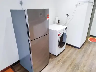 a refrigerator and a washing machine in a room at Arina Uniti Kampung Baru HKL - Idealhub in Kuala Lumpur