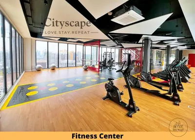 a gym with treadmills and ellipticals in a building at Majestic Residence Kuala Lumpur by Cityscape in Kuala Lumpur