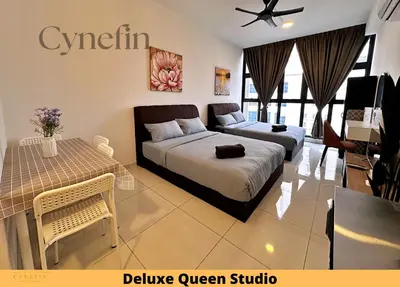 a bedroom with a bed and a table and a couch at Majestic Residence Kuala Lumpur near Bukit Bintang & Chow Kit in Kuala Lumpur