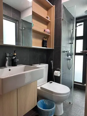 a bathroom with a sink and a toilet and a shower at The Colony By Infinitum With Rooftop Pool in Kuala Lumpur