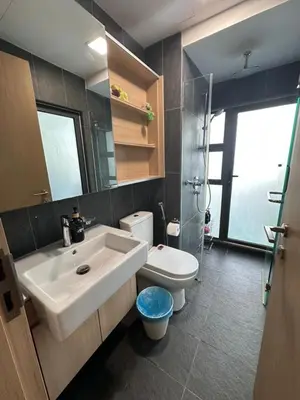 a bathroom with a sink and a toilet at The Colony By Infinitum With Rooftop Pool in Kuala Lumpur