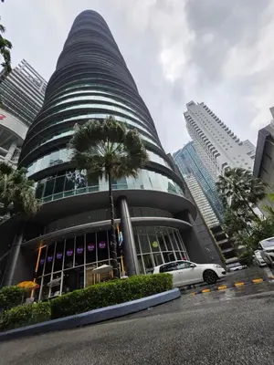 a car parked in front of a building at Vortex suites klcc by KAZI in Kuala Lumpur