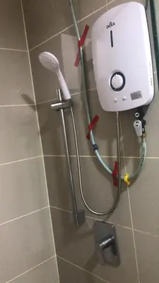 a shower with a shower head in a bathroom at Sentul Kuala Lumpur Private Medium Room Home Stay Shared Common Area With Host in Kuala Lumpur