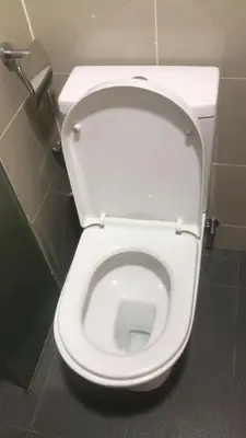 a white toilet with the seat up in a bathroom at Sentul Kuala Lumpur Private Medium Room Home Stay Shared Common Area With Host in Kuala Lumpur