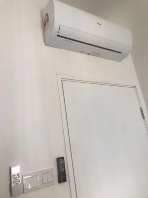 a bathroom with a white door and a security camera at Sentul Kuala Lumpur Private Medium Room Home Stay Shared Common Area With Host in Kuala Lumpur