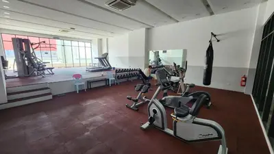 a gym with several treadmills and machines in a room at Dsir Lustful KL Jacuzzi NFLX Prjscn120 TV65 in Kuala Lumpur