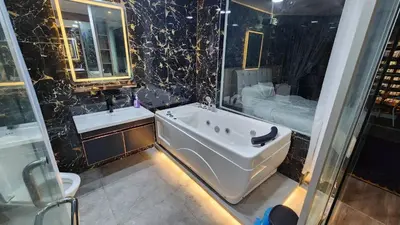 a bathroom with a tub and a sink and a shower at Dsir Lustful KL Jacuzzi NFLX Prjscn120 TV65 in Kuala Lumpur
