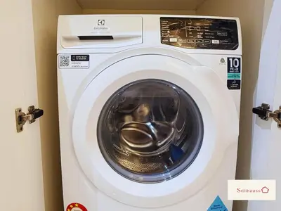 a white washing machine in a room at KLCC View Walk to PWTC & Sunway Putra 3 Pax in Kuala Lumpur