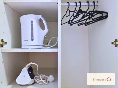 a tea kettle and a toaster on a shelf at KLCC View Walk to PWTC & Sunway Putra 3 Pax in Kuala Lumpur