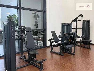 a gym with treadmills and ellipticals in a room at KLCC View Walk to PWTC & Sunway Putra 3 Pax in Kuala Lumpur