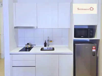 a white kitchen with a sink and a refrigerator at KLCC View Walk to PWTC & Sunway Putra 3 Pax in Kuala Lumpur