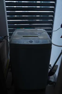 a cpu is sitting in a room with a window at KL Hartamas Studio, Wifi Smart TV in Kuala Lumpur