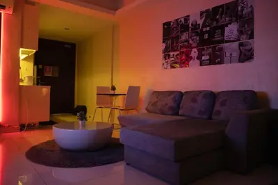 a living room with a couch and a coffee table at KL Hartamas Studio, Wifi Smart TV in Kuala Lumpur