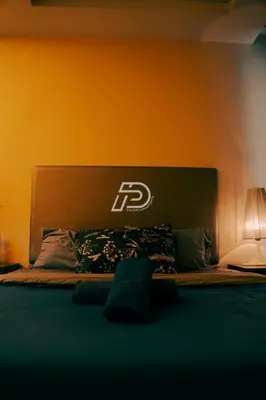 a bedroom with a bed with a lettering on it at Lux Studio Plaza Damas Kuala Lumpur KL in Kuala Lumpur