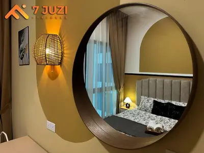 a bedroom with a large circular mirror on the wall at KLCC 23A Premium 1B1R with Best View Infinity Pool and Netflix 1080HD in Kuala Lumpur