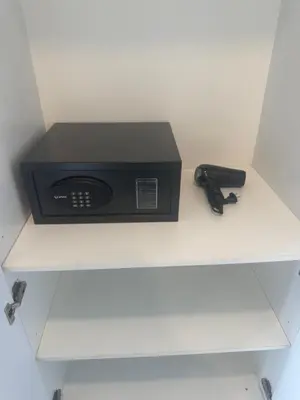 a black router sitting on top of a shelf at ROBERTSON RESIDENCE KUALA LUMPUR By IKNAS SUITES in Kuala Lumpur
