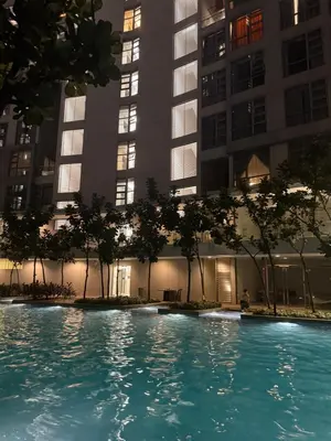 a swimming pool in front of some tall buildings at ROBERTSON RESIDENCE KUALA LUMPUR By IKNAS SUITES in Kuala Lumpur