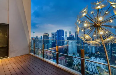 a balcony with a view of a city skyline at Agile Bukit Bintang TRX KL City by Cobnb in Kuala Lumpur