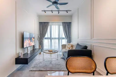 a living room with a couch and a tv at Agile Bukit Bintang TRX KL City by Cobnb in Kuala Lumpur